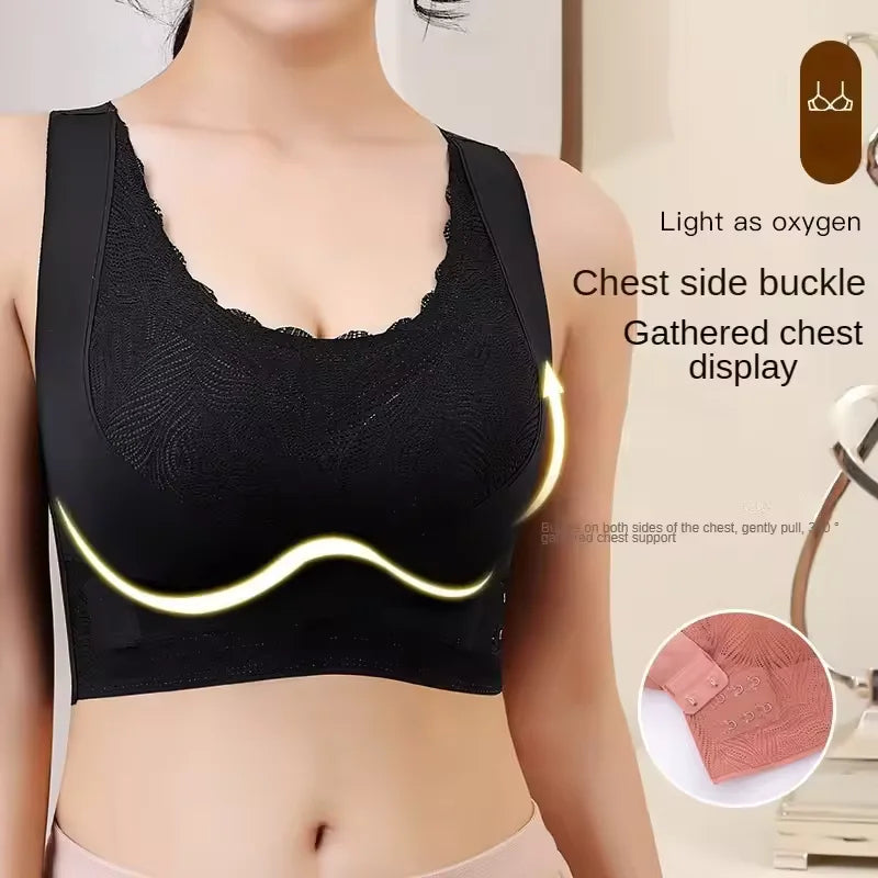 Black sports bra with chest side buckle feature on a model.